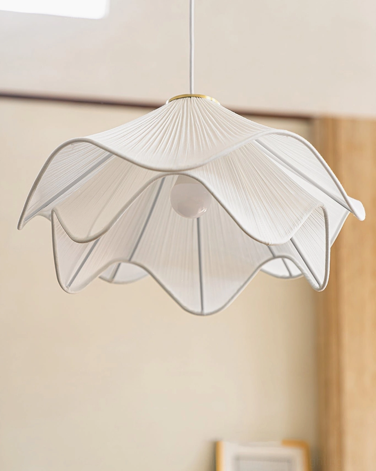 Bottom view of Lia pendant lamp showing exposed E26/E27 socket and layered pleated fabric shade construction, detailed fixture design