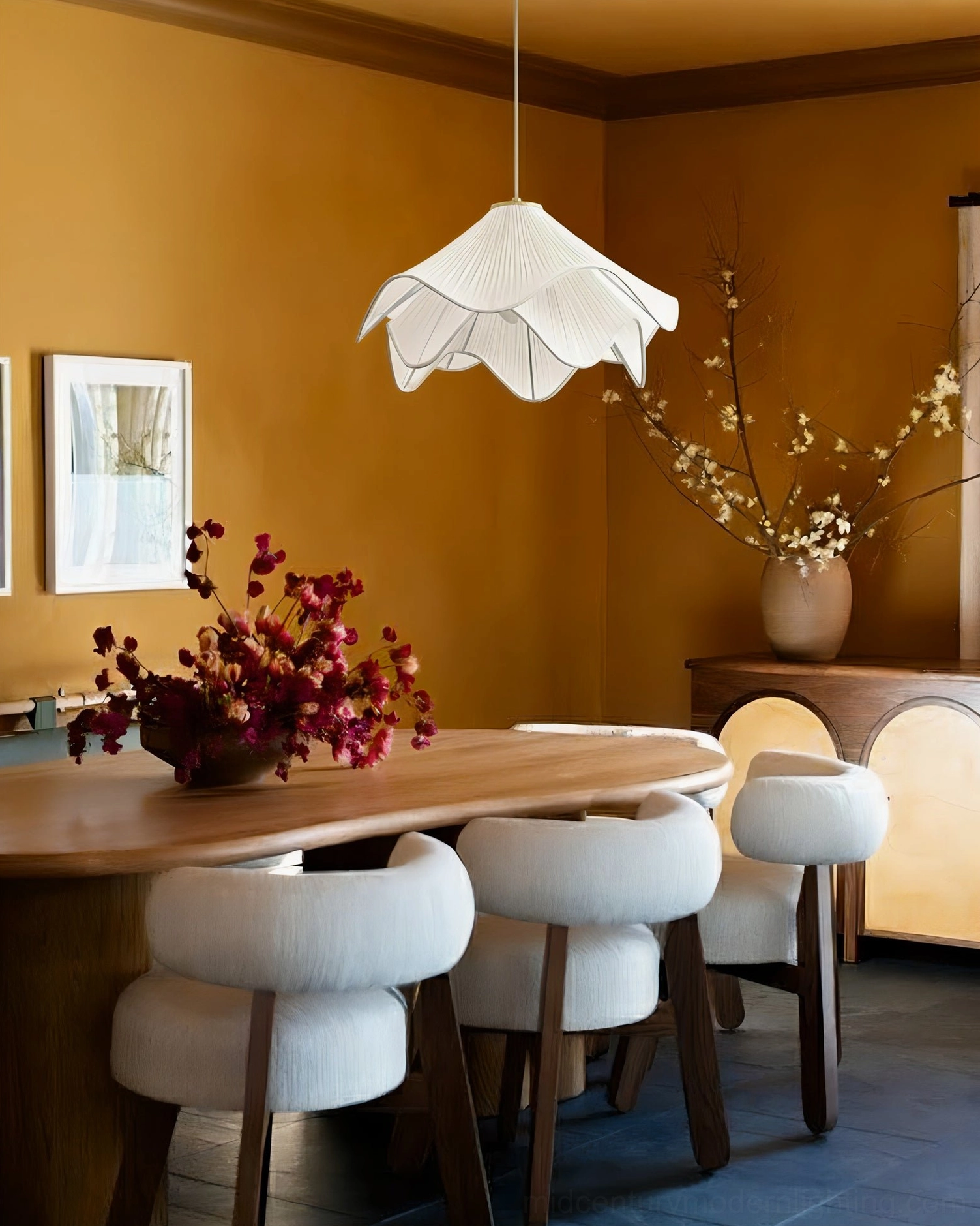 Lia flower-shaped pleated pendant light in warm tone dining room, showcasing boho japandi home decor aesthetic with natural textures