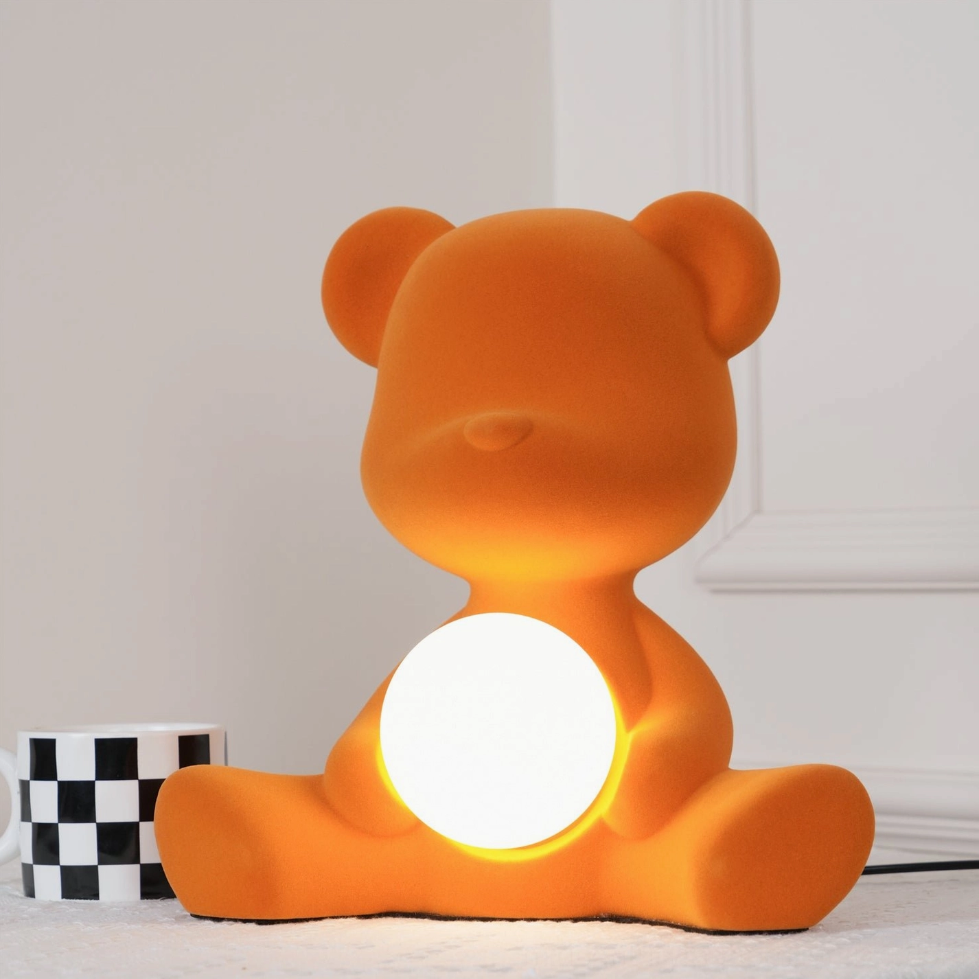 Light brown teddy bear table lamp on neutral background showing color tone