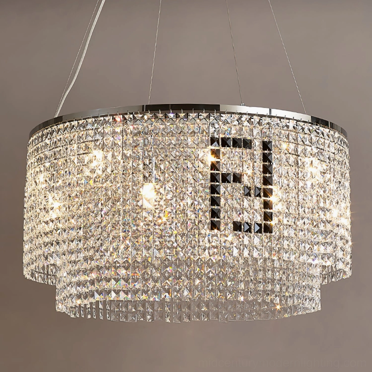 Two-tier round crystal chandelier close-up with sparkling faceted crystals and chrome hardware on dark background