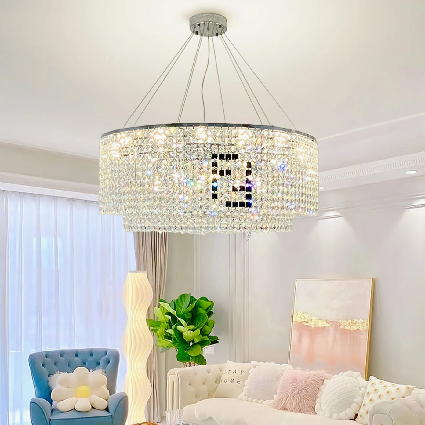 Crystal chandelier in bright modern living room with upholstered sofas, demonstrating clear crystal lighting effects