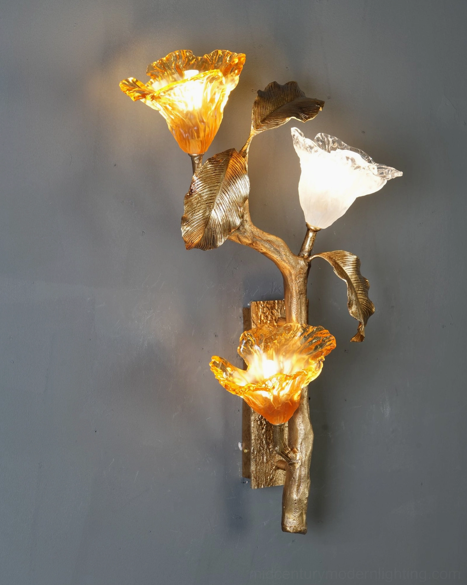 Brass lily branch wall sconce showing three glass bloom configuration and wall mounting detail