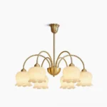 Lily of the Valley 6-head brass chandelier with cream resin shades, direct overhead studio view showcasing mid-century modern design and botanical-inspired architecture