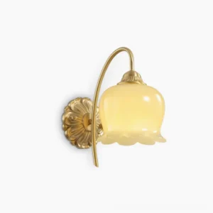 Lily of the Valley wall lamp front view with cream glass shade and brass mounting on white background