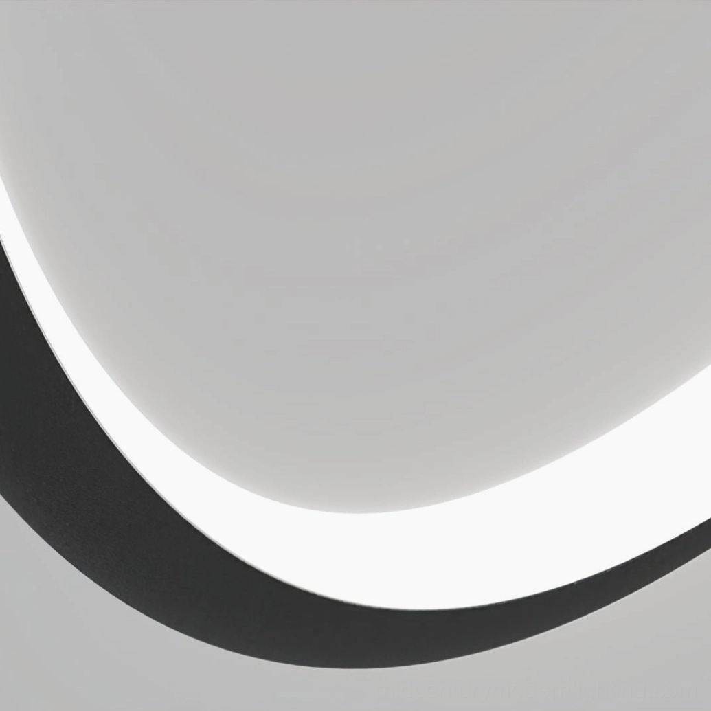 Linea Curva curved LED strip ceiling light with matte black frame and warm white diffused illumination