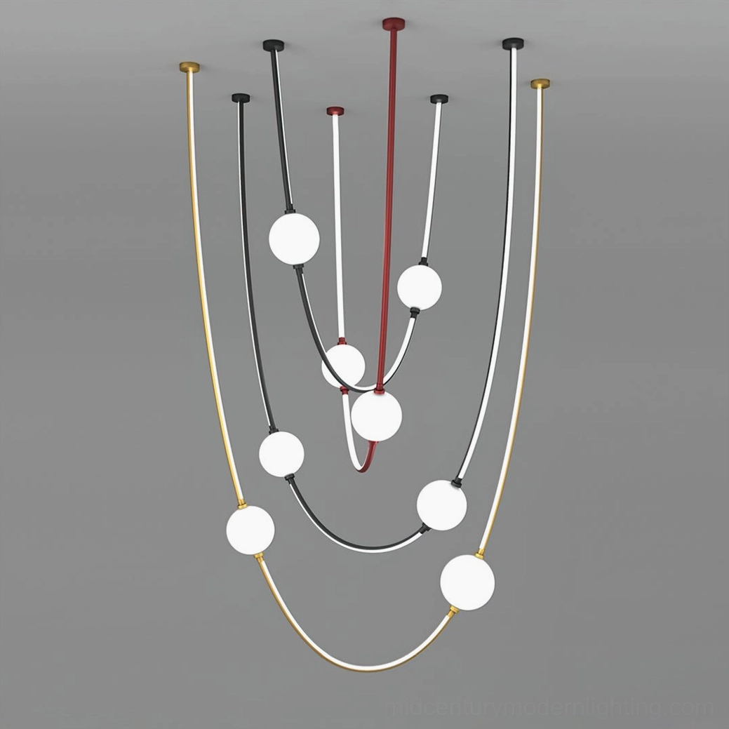Modern curved linear chandelier with multiple frosted glass ball fixtures and mixed color metal framework in studio setting