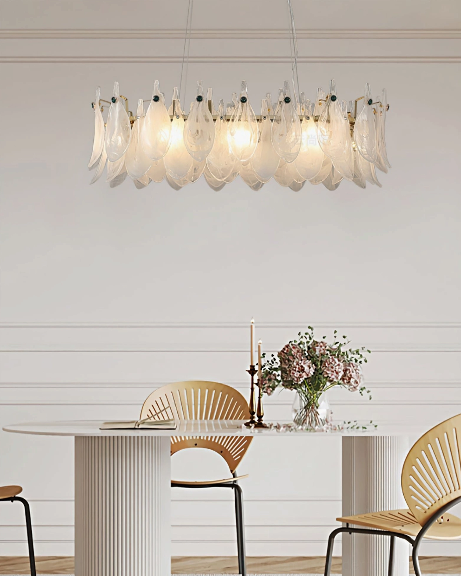 Linear frosted glass petal chandelier overhead view in minimalist dining space