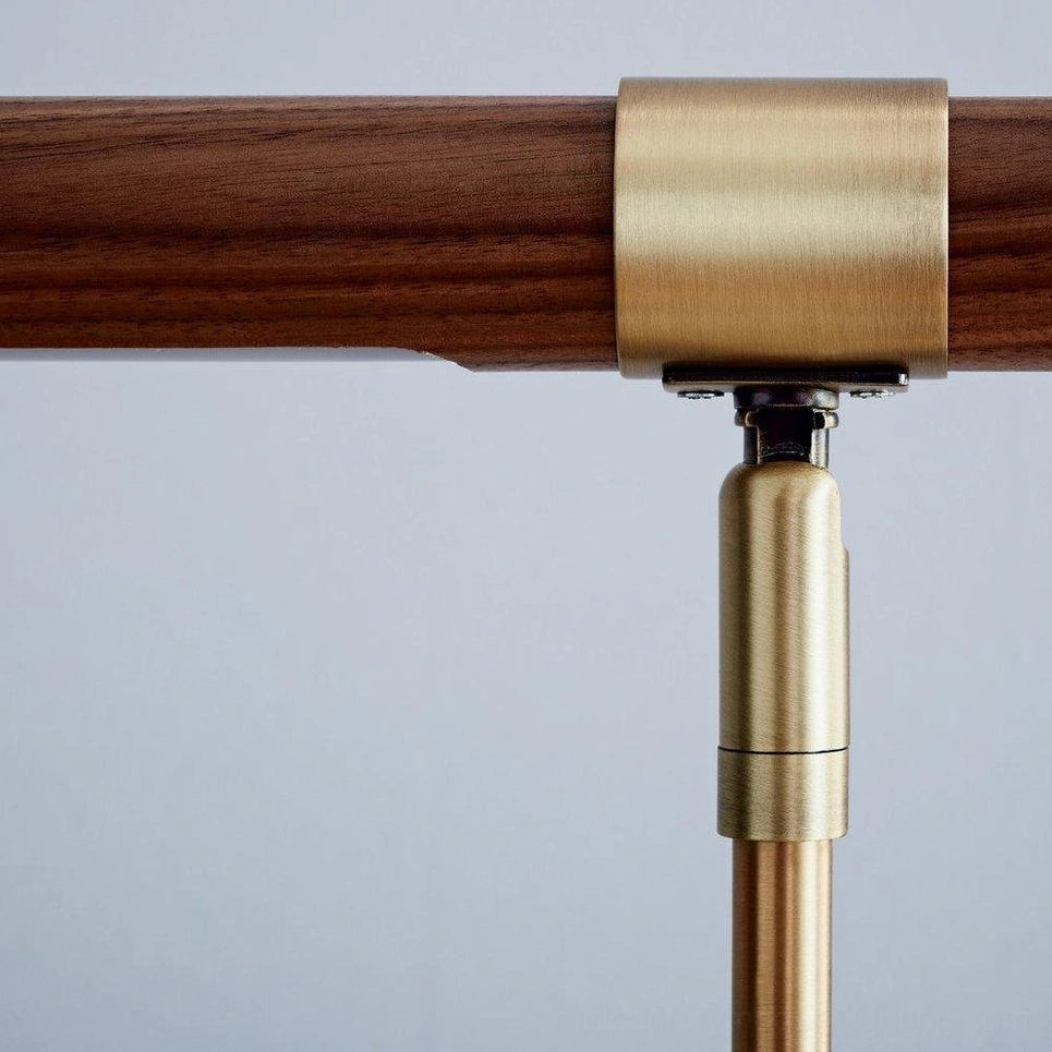 Linear adjustable table lamp gold and walnut material showcase, studio product photography detail view