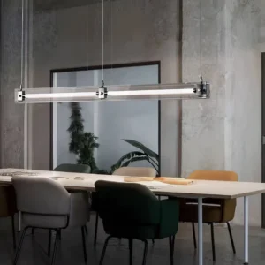 Modern linear pendant light suspended over contemporary dining table in minimalist office setting
