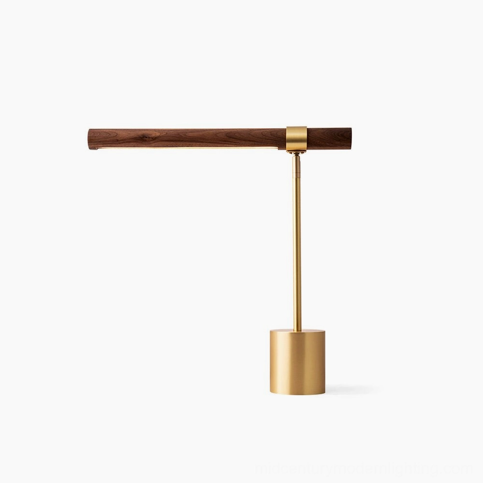 Linear adjustable table lamp with polished gold metal stem and walnut wood base, front view studio shot with minimalist styling