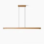 Linear wooden LED pendant light with natural wood finish and brass accents on white background, showing clean minimalist design
