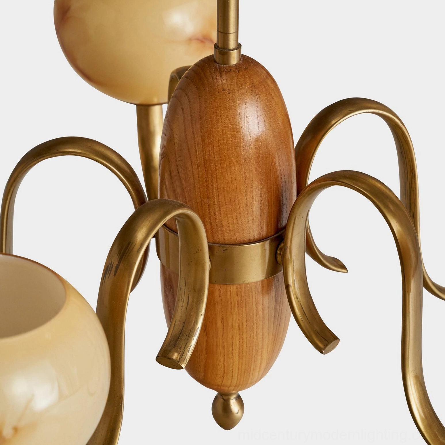 Linnea 5-light chandelier installed in mid-century dining room setting with warm overhead lighting
