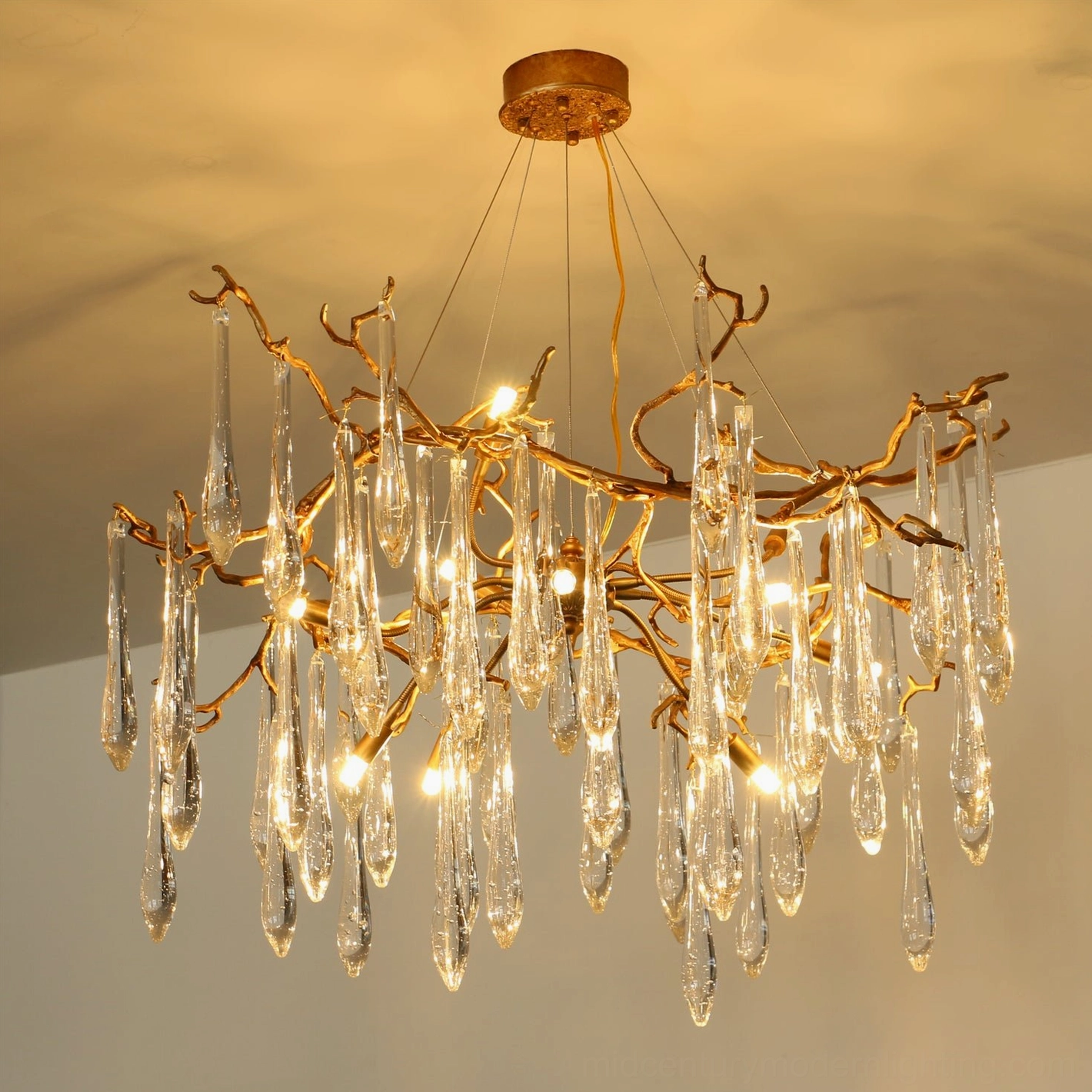 Livio Branch Chandelier installed in contemporary bedroom, creating intimate luxury lighting atmosphere