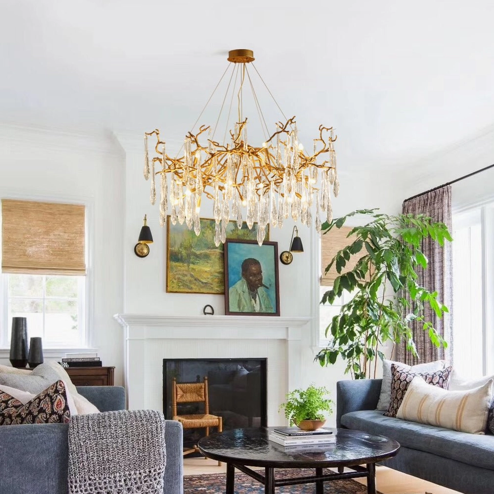 Livio Crystal Branch Chandelier installed in classic American living room with fireplace, warm luxury ambiance