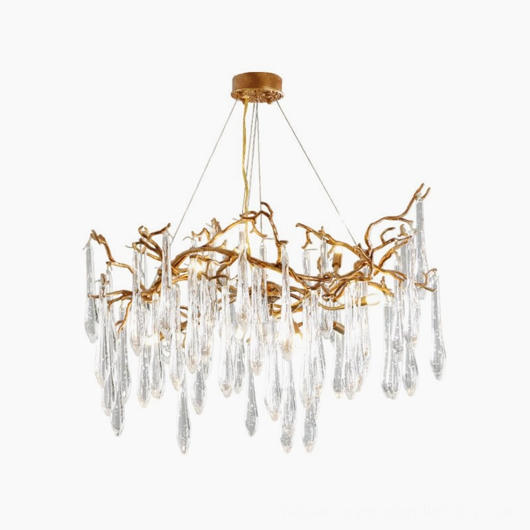 Medium Livio Chandelier suspended in contemporary space with warm metallic glow creating atmospheric shadows