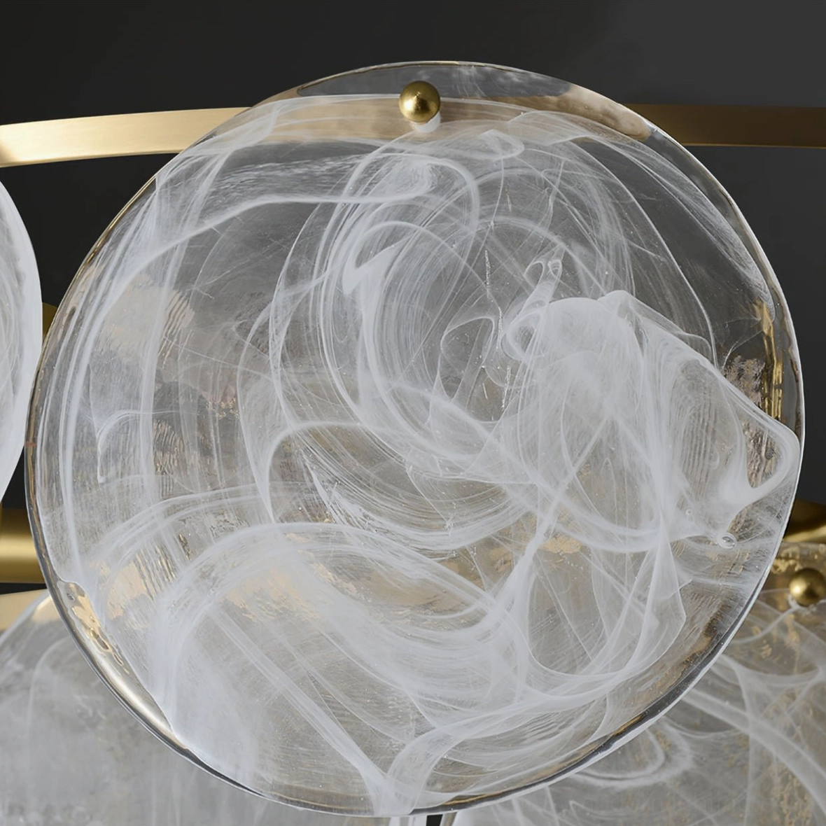 Loire Chandelier side view detail of brushed brass frame and translucent frosted glass cloud pendant design