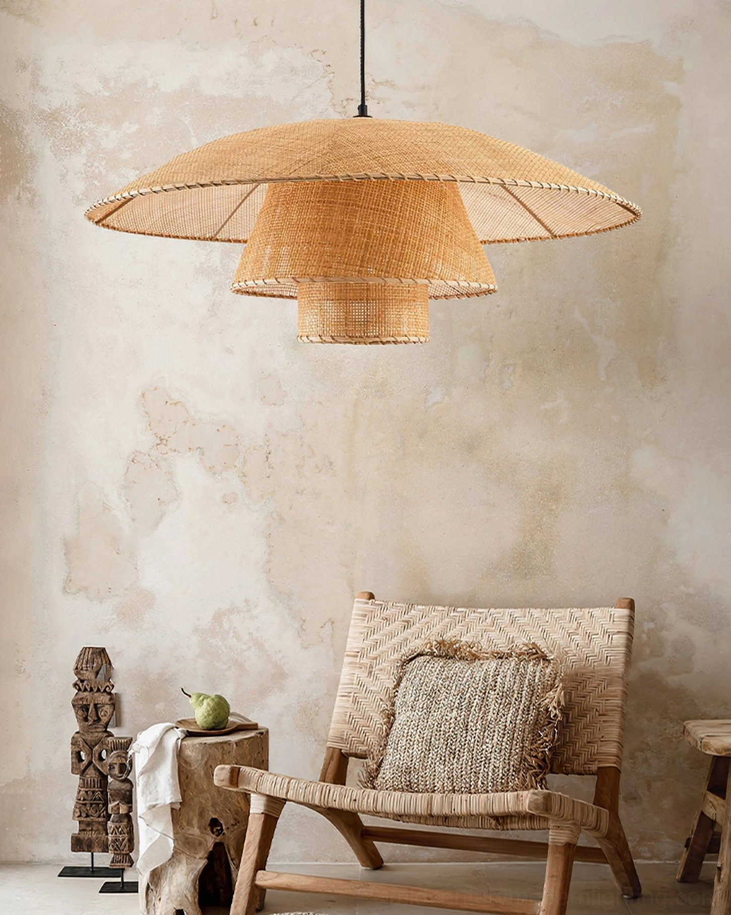Lola rattan pendant lamp in light beige natural finish displayed in rustic bohemian living corner