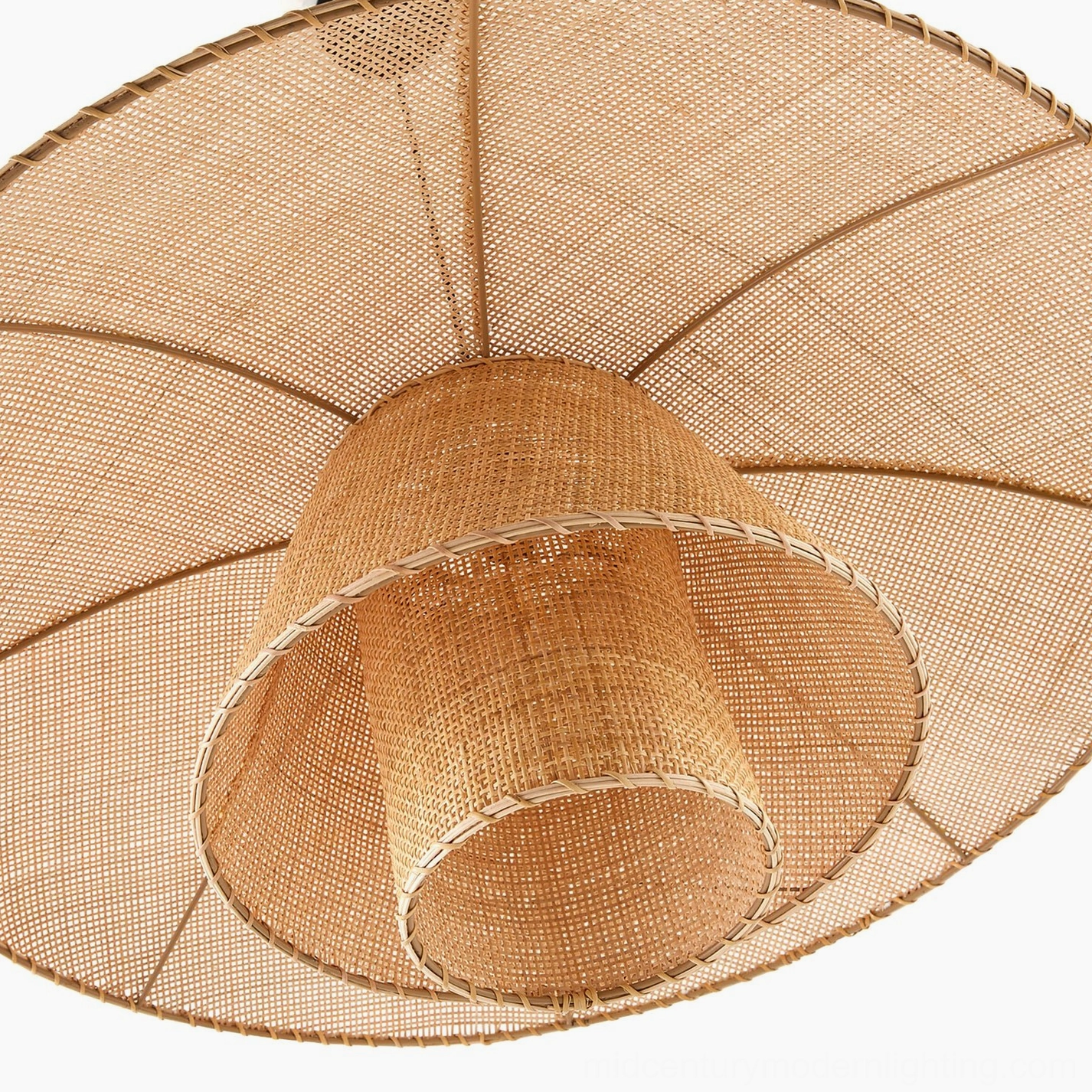 Close-up detail of Lola rattan pendant lamp shade showing hand-woven multi-layer texture