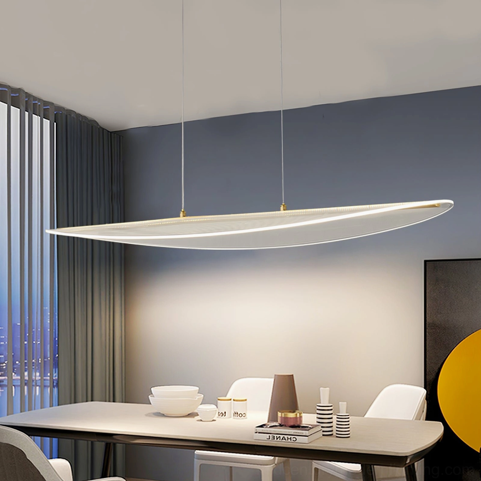 Long strip frosted pendant light in residential dining room with natural window light