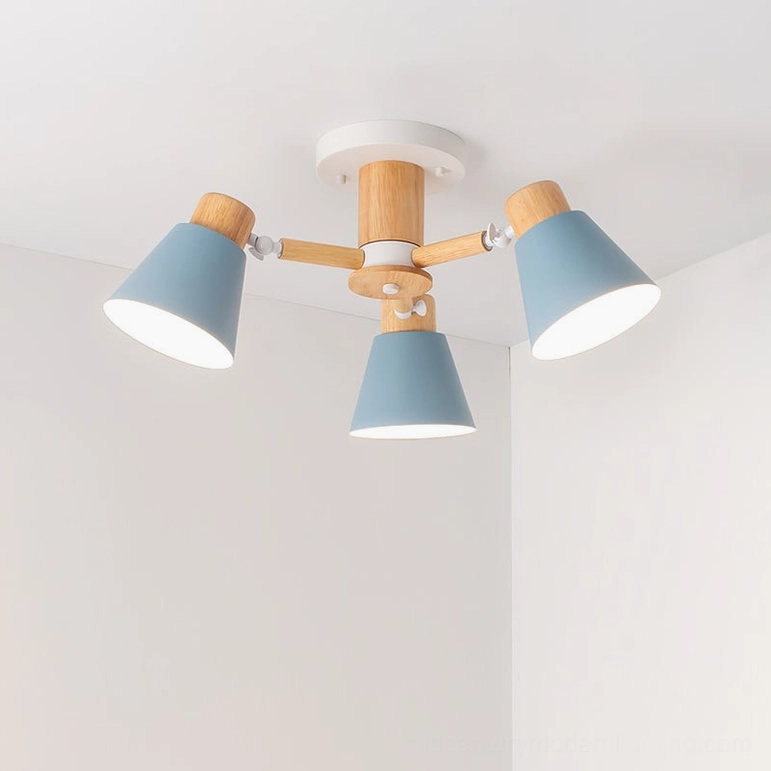 3-head Loona ceiling lamp overhead studio shot with compact blue matte shades and natural wood frame