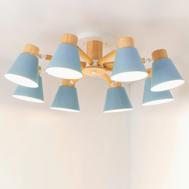 8-head Loona ceiling lamp overhead studio shot with matte blue shades and wooden bracket on warm background