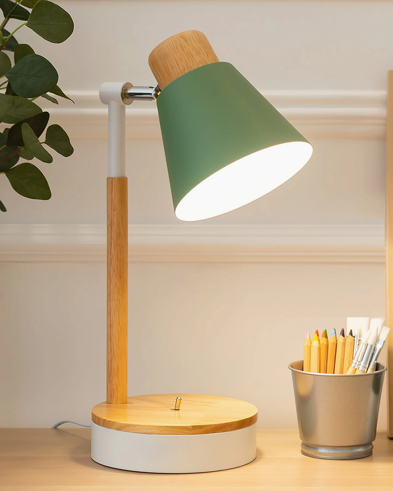 Sage green Loona minimalist lamp showcasing natural wood grain and matte metal finish - botanical aesthetic
