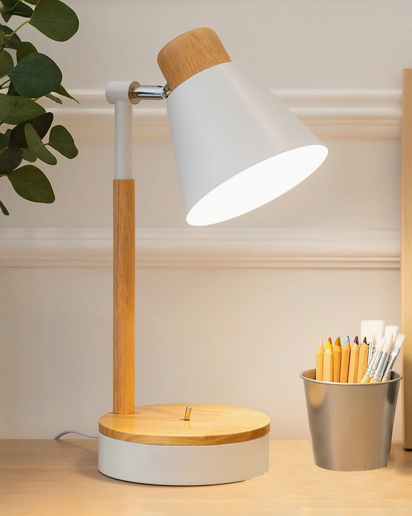 White Loona minimalist lamp with metal pen holder accent on contemporary workspace desktop