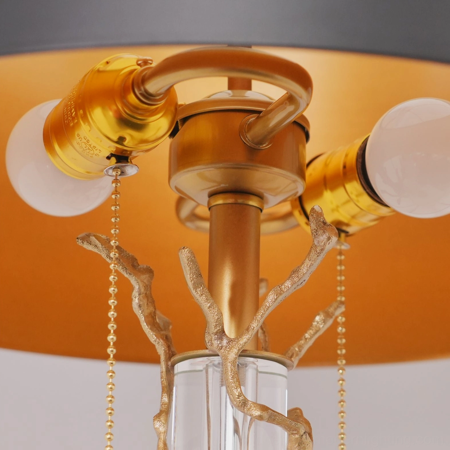 Lora table lamp top-down view of dual socket configuration, gold branch hardware, and pull-chain switches
