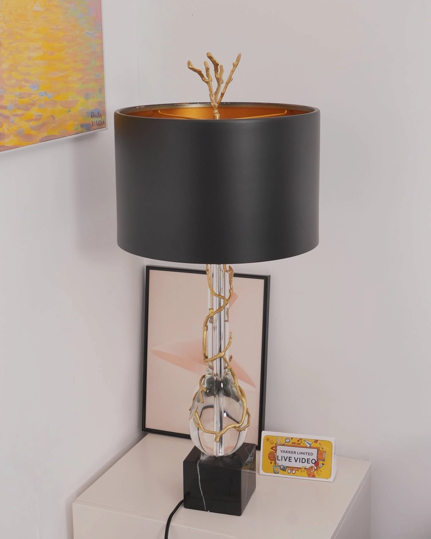 Lora desk lamp side view highlighting sculptural gold twig design and black marble base architectural detail