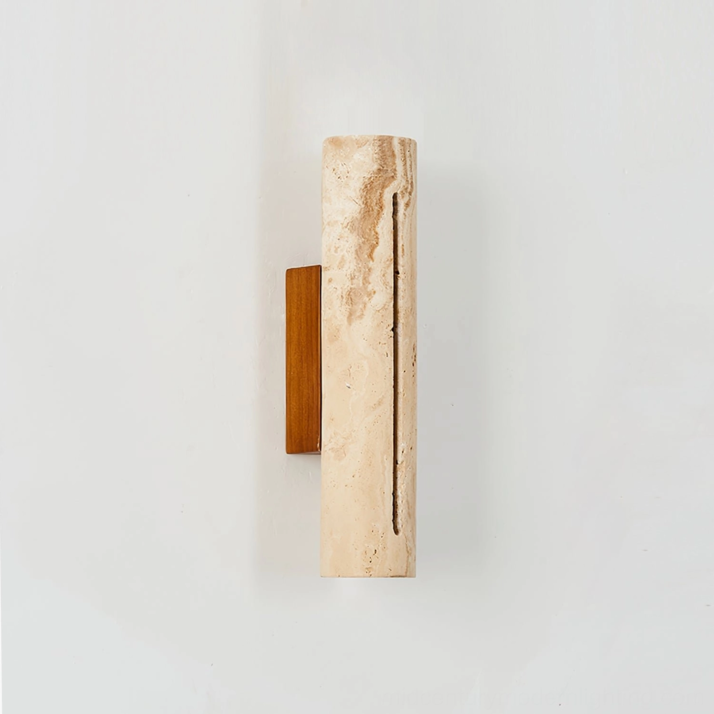 Side view of Lorelei travertine wall sconce showing linear light slot and brown wooden mounting bracket