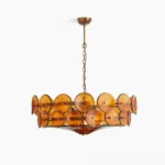 Lorenzo mid-century modern glass disc chandelier with amber orange Murano-style discs and bronze frame, front studio view
