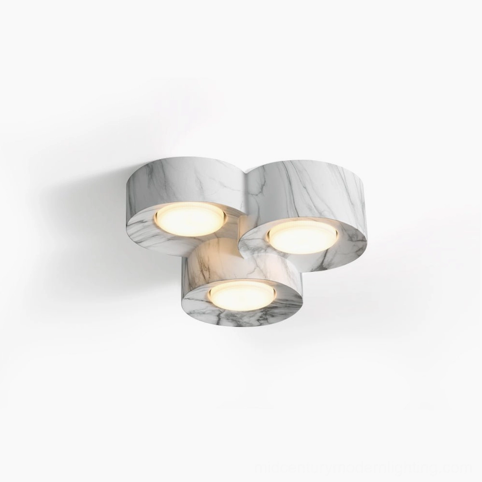 Loris triple clover ceiling light in warm walnut marble resin, top-down studio view