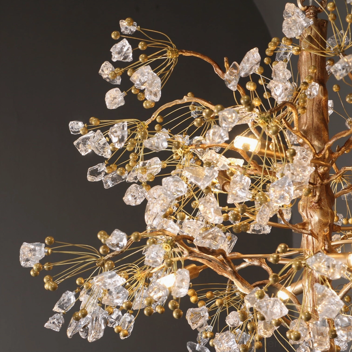 Lorna Berry chandelier close-up of brass branches and glass elements