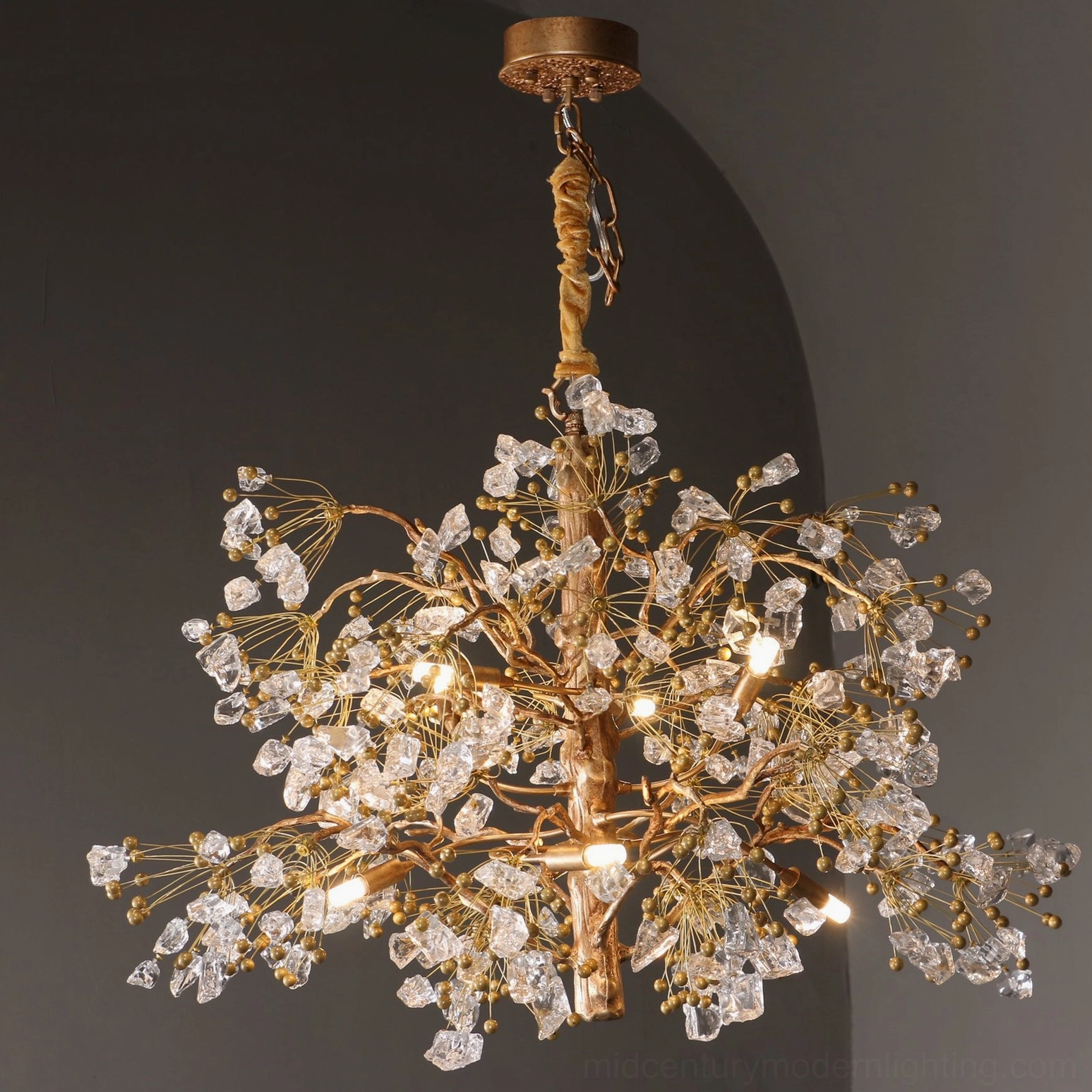 Glass berry chandelier showing intricate brass metalwork and detail