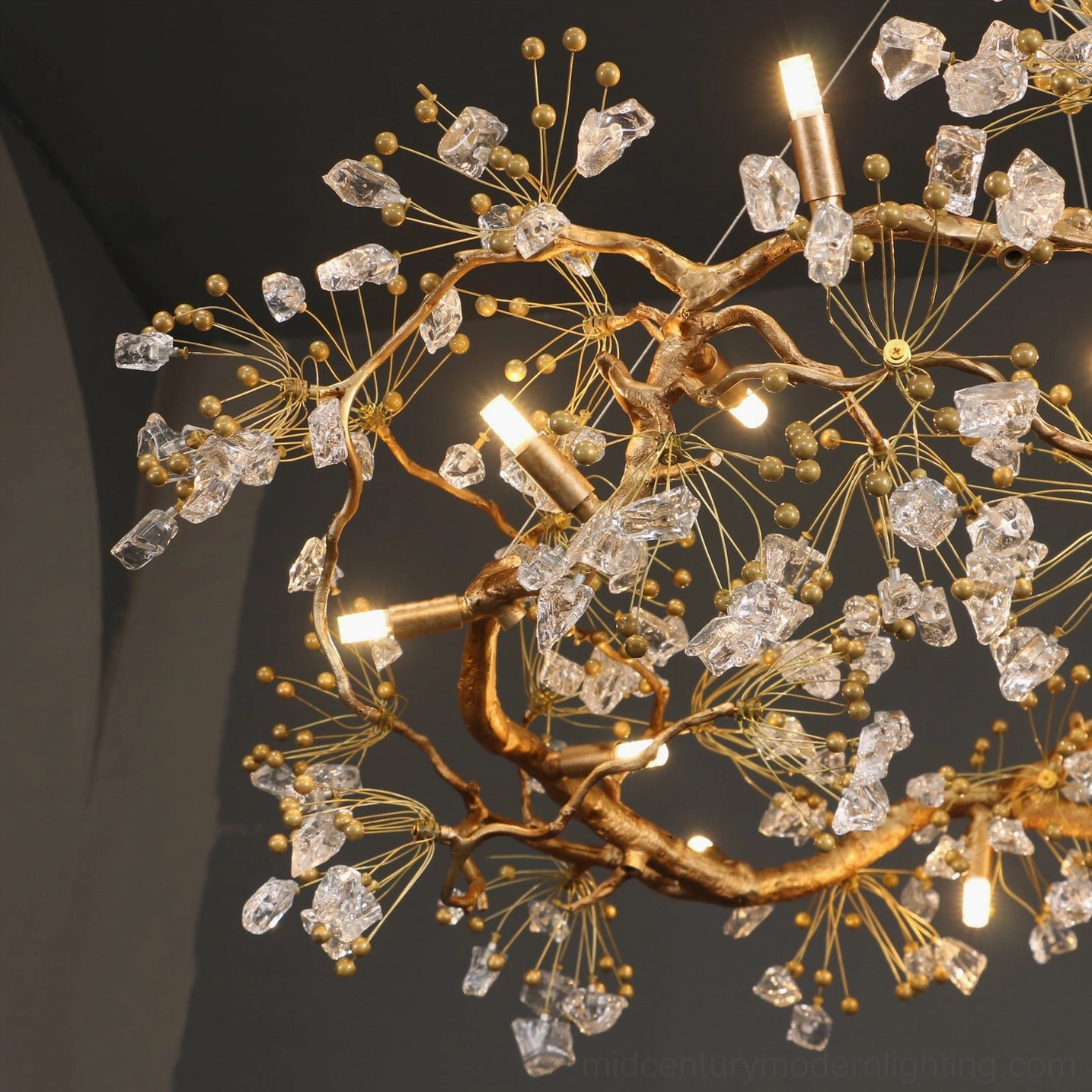 Antique brass chandelier with glass berries - side angle view
