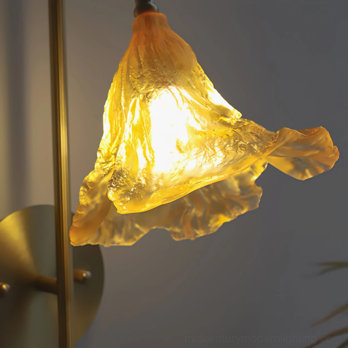 Lotus Amber Wall Sconce full product view showing mid-century modern design with brass arm, amber glass shade, and wall mounting hardware