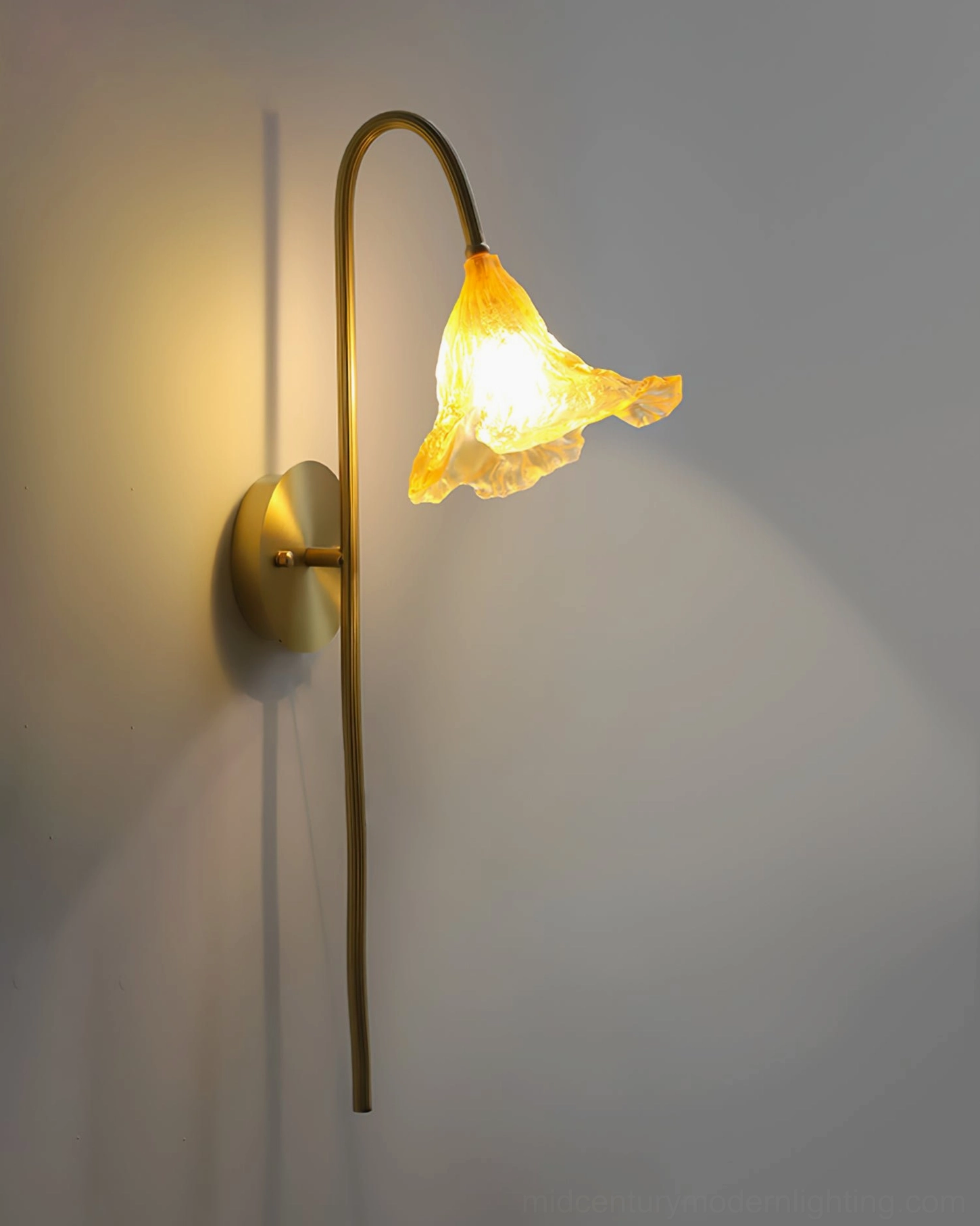 Lotus Amber Wall Sconce multiple angle view showcasing sculptural brass design and delicate ruffled amber glass shade