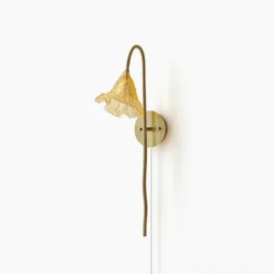 Lotus Amber plug-in wall sconce with brass stem and hand-ruffled amber glass shade, frontal studio view
