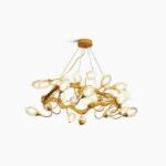Lotus brass chandelier with 16 teardrop glass shades overhead view studio photography