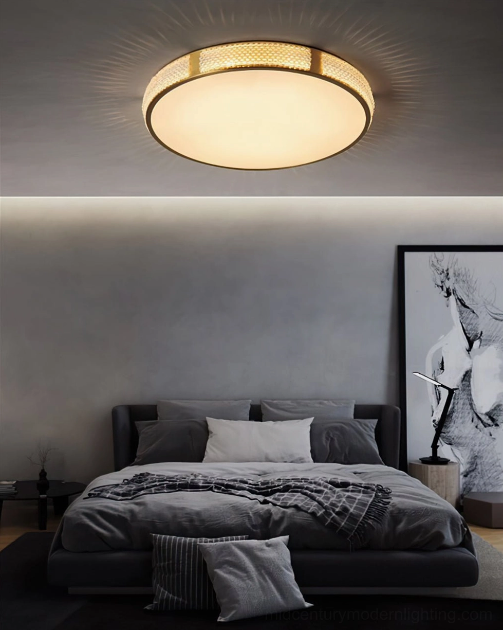 Lovate flush mount ceiling lamp above master bedroom with dark upholstered bed, warm glowing light minimalist style