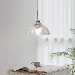 Lucinda pendant lamp installed in minimalist dining nook with sheer curtains, vintage ambiance