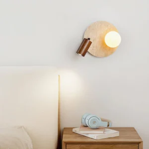 Luka Travertine Wall Lamp installed in contemporary bedroom as bedside lighting fixture with warm ambient glow and dark wood mounting