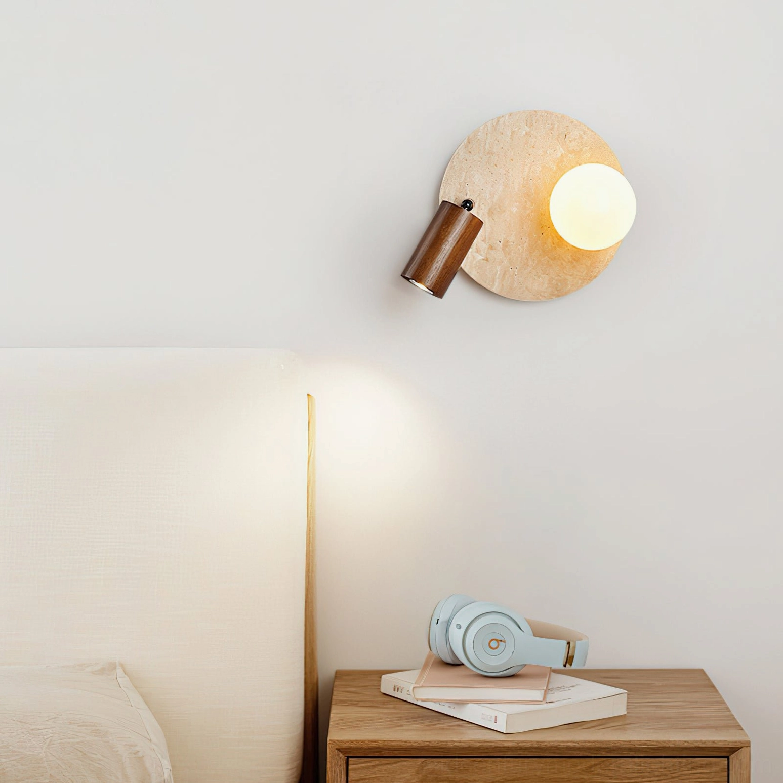 Luka Travertine Wall Lamp installed in contemporary bedroom as bedside lighting fixture with warm ambient glow and dark wood mounting