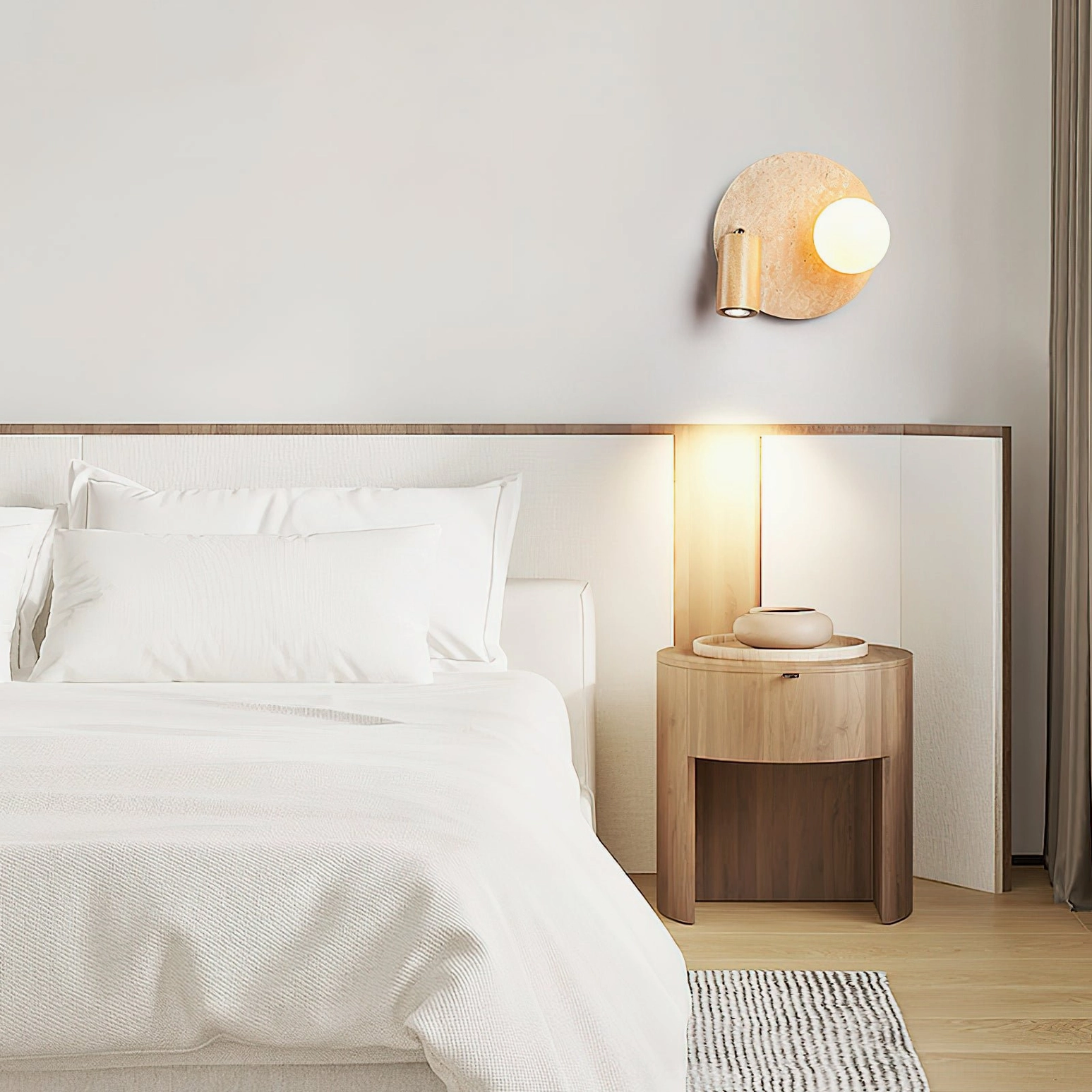 Luka Travertine Wall Lamp distant bedroom wall installation with neutral tones and matching round bedside table mid-century modern styling