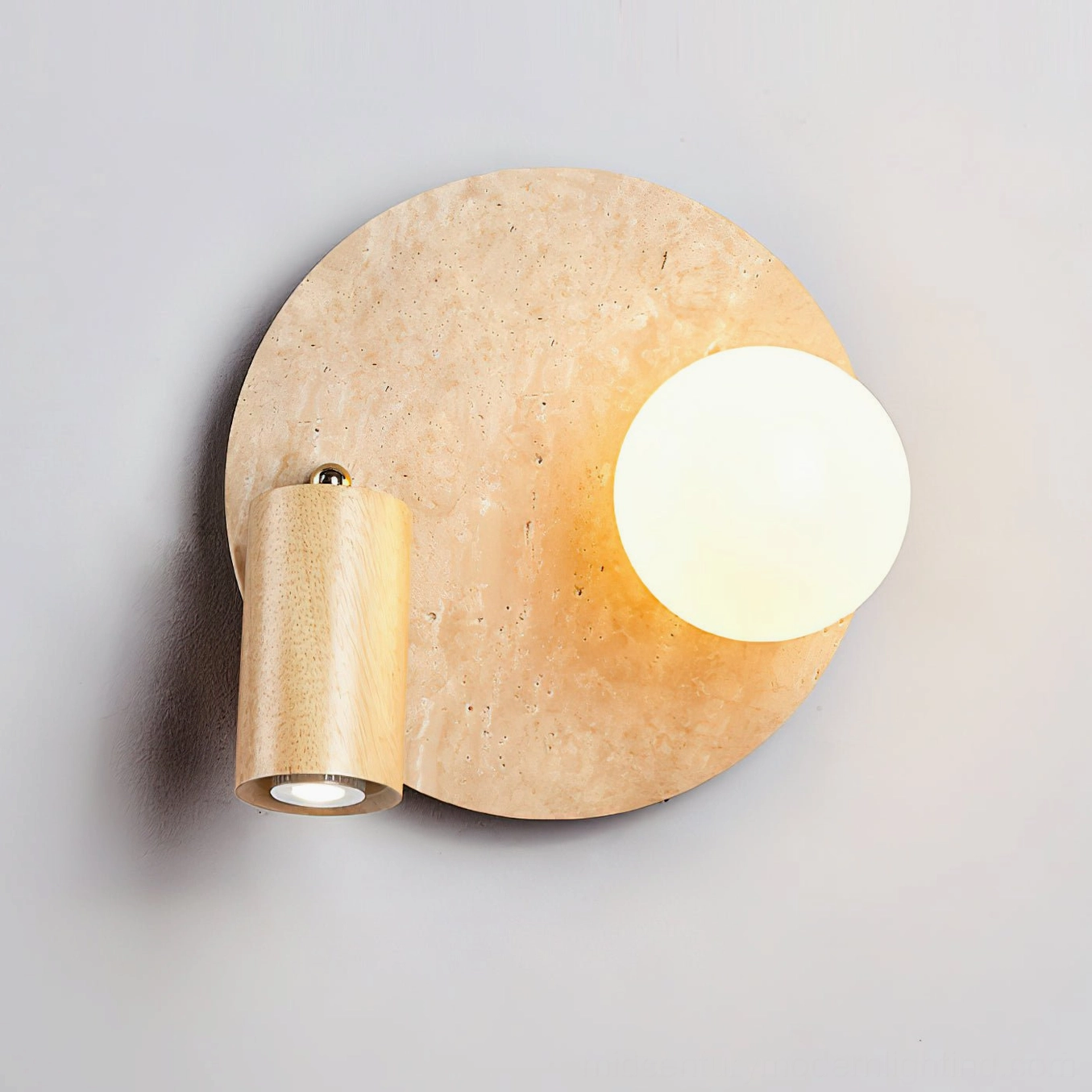 Luka Travertine Wall Lamp lifestyle shot in styled bedroom interior with warm lighting ambiance and mid-century modern decor elements