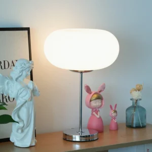 Lumi table lamp styled on decorative home desk with modern minimalist aesthetic and warm ambient lighting