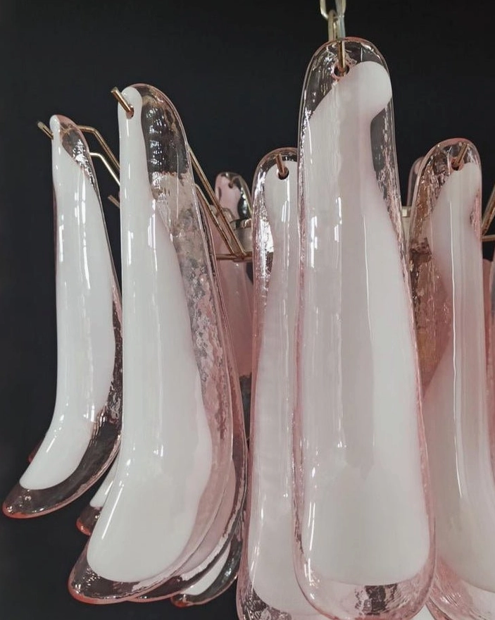 Luna chandelier brass metal fixtures and hand-blown curved glass petals, craftsmanship detail