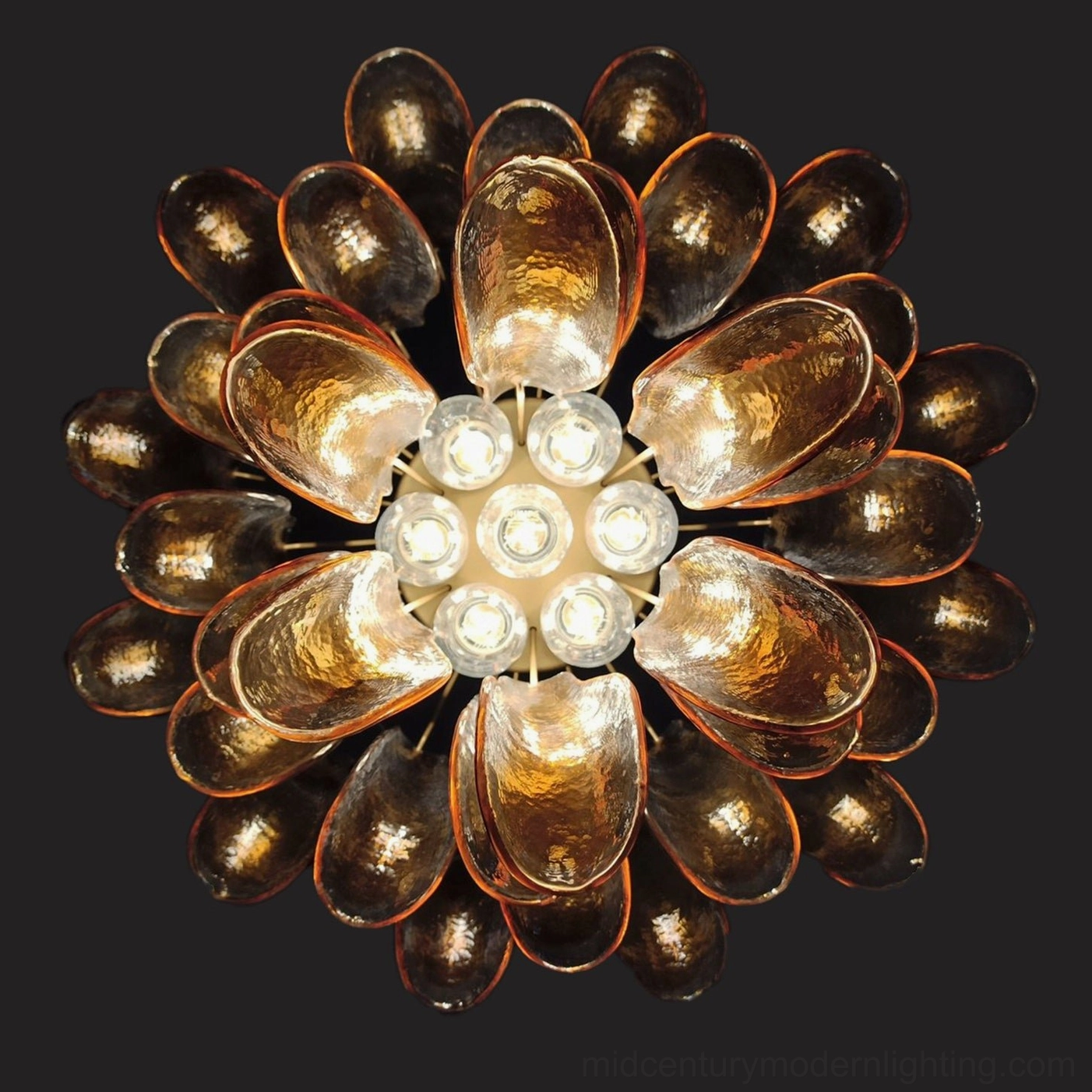 Luna chandelier with hand-blown pink glass petals casting soft romantic ambient light
