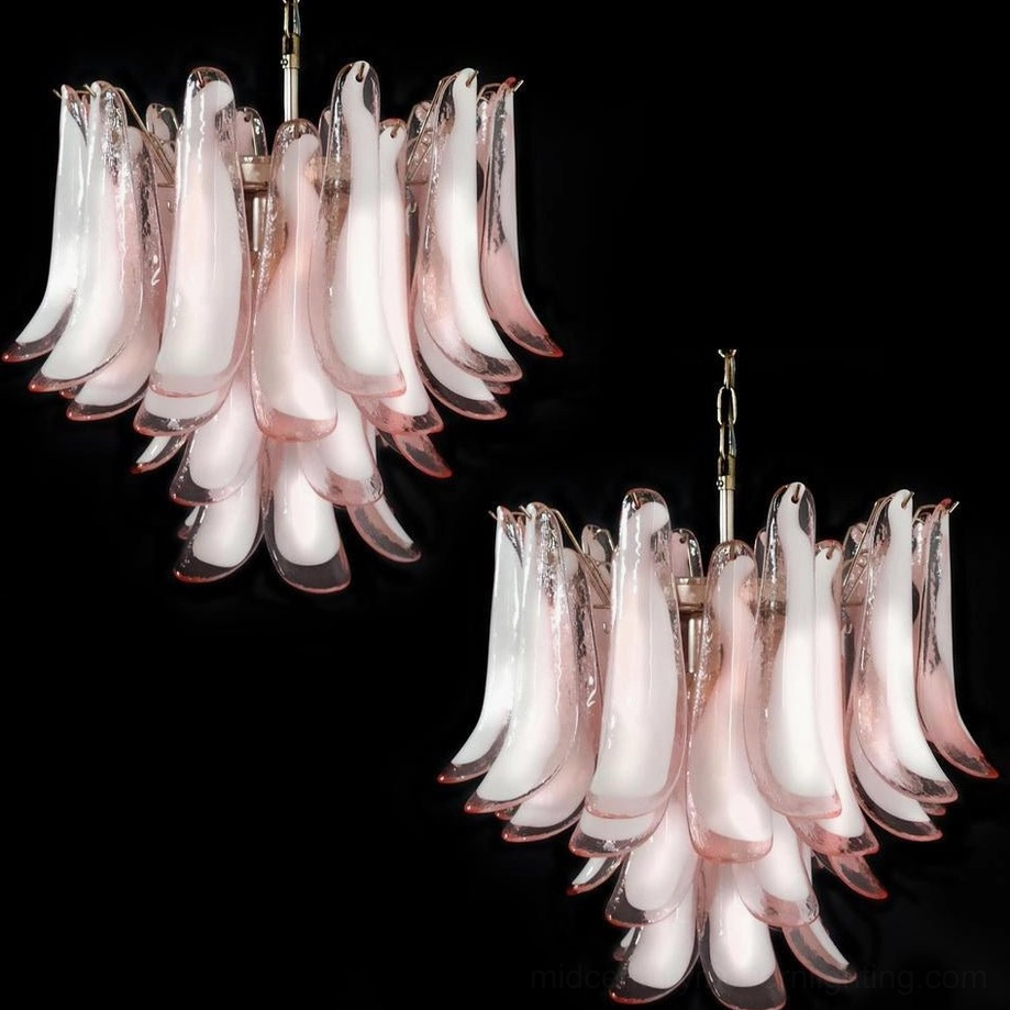 Two Luna Murano glass chandeliers with pink hand-blown petals, low angle luxury lighting comparison