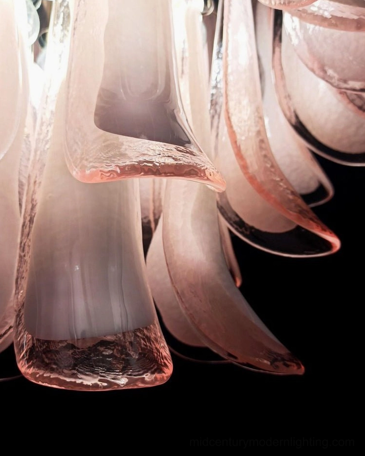 Side close-up view of Luna chandelier's two-tone pink and white hand-blown glass petals